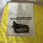 Toyota Land Cruiser FJ40 2F Oil Filter Housing Mounting Bracket. Fixed Price $43.00.